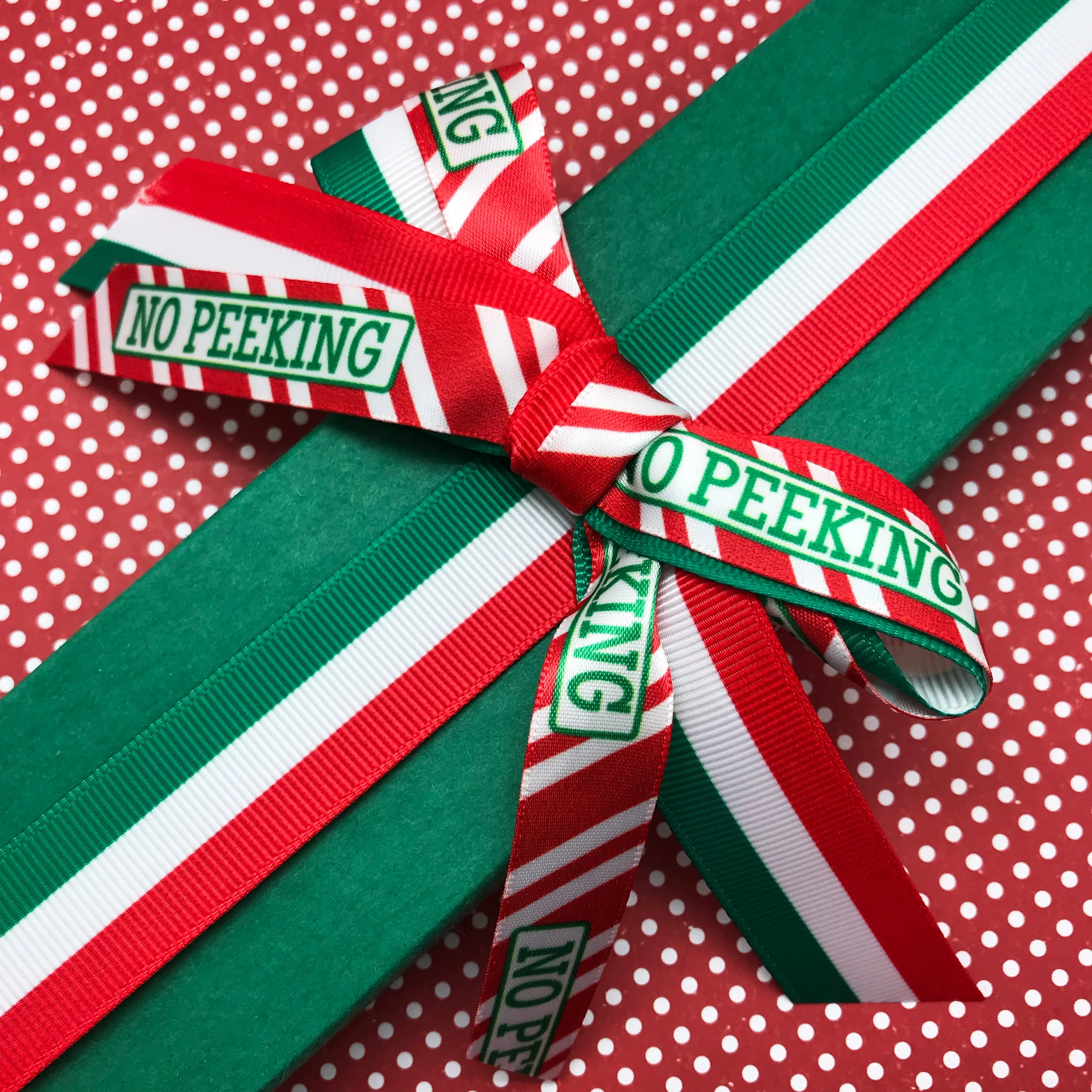 No Peeking! Christmas Ribbon in green with red and white stripes printed on 5/8" White SFS